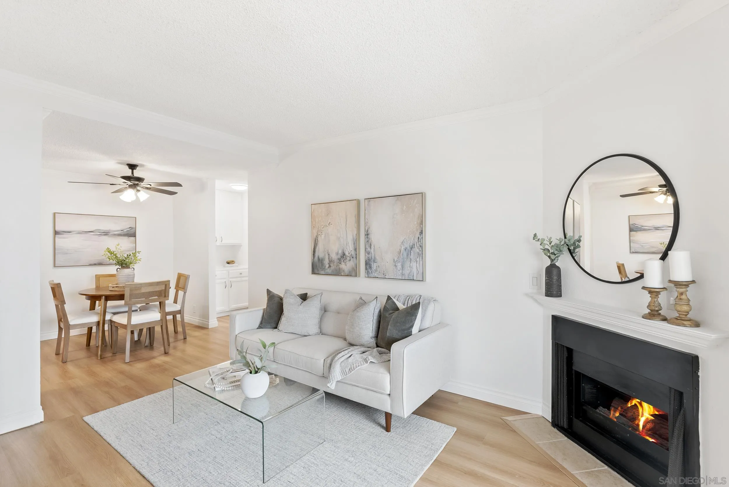 830 Broadway, Unit 15 El Cajon, CA 92021 - Photo 1 of 21 a living room with furniture a fireplace and a table