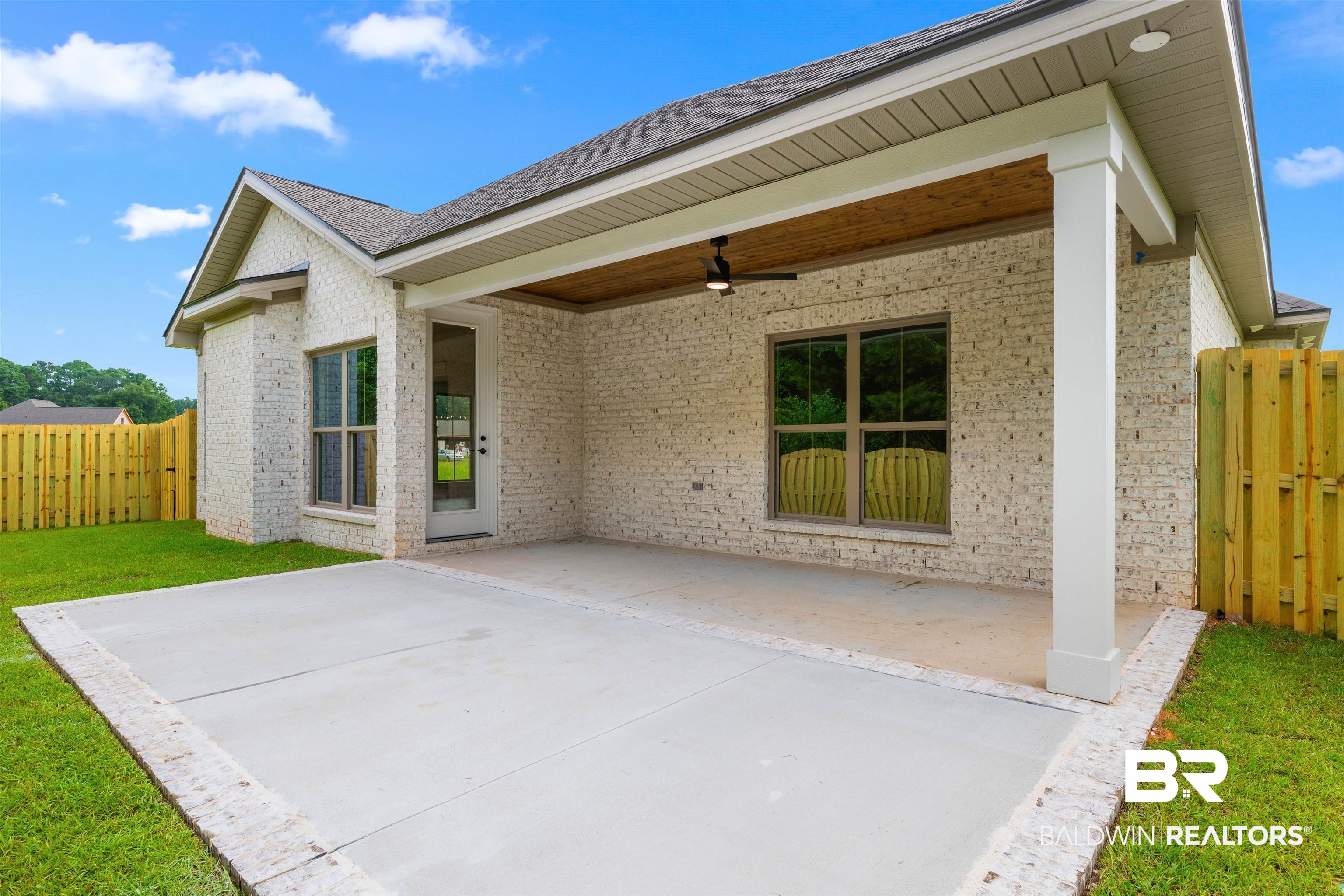 27494 Patch Pl Loop Daphne, AL 36526 - Photo 25 of 26 Spacious concrete patio with a covered porch, wood-finish ceiling, and ceiling fan