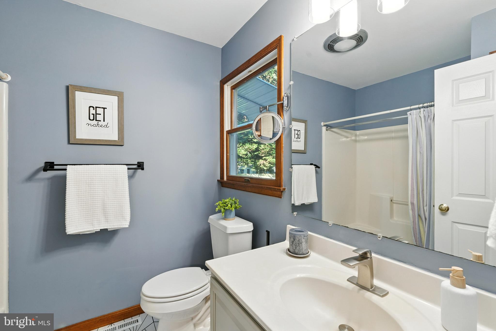 105 Parma Road Chestertown, MD 21620 - Photo 11 of 28 a bathroom with a sink mirror vanity and toilet