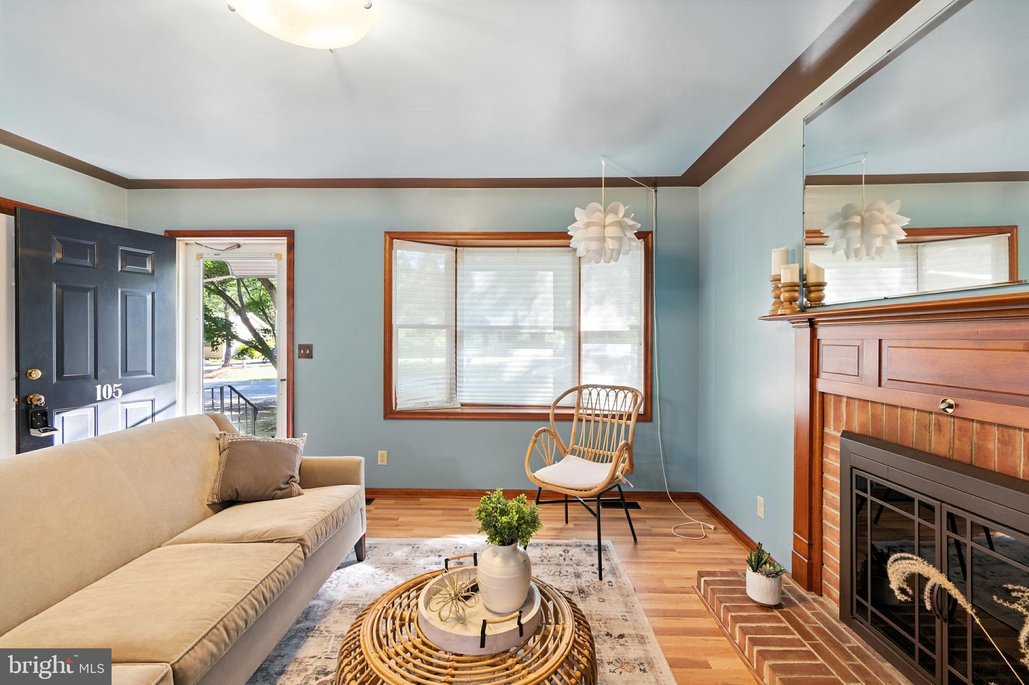 105 Parma Road Chestertown, MD 21620 - Photo 3 of 28 a living room with furniture a fireplace and a window