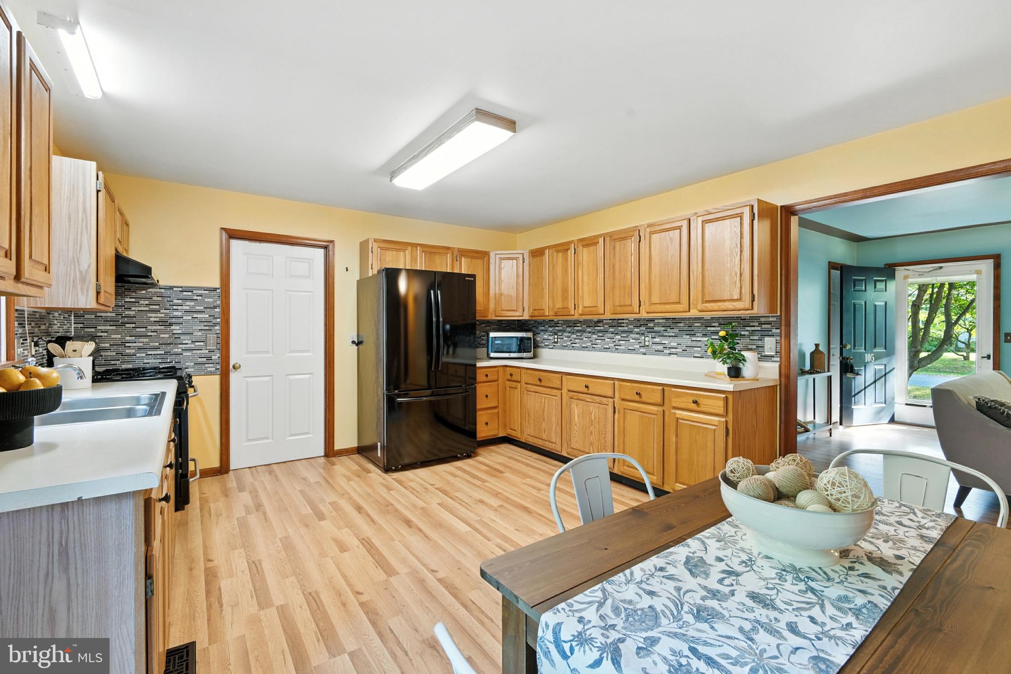 105 Parma Road Chestertown, MD 21620 - Photo 7 of 28 a kitchen with stainless steel appliances granite countertop a refrigerator stove top oven and sink