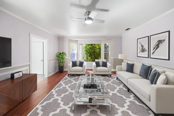 a living room with furniture or couch and a large window