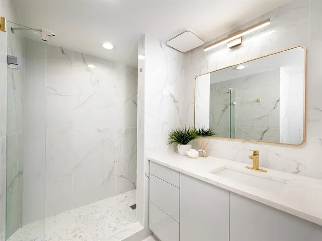 a kitchen with a sink and refrigerator