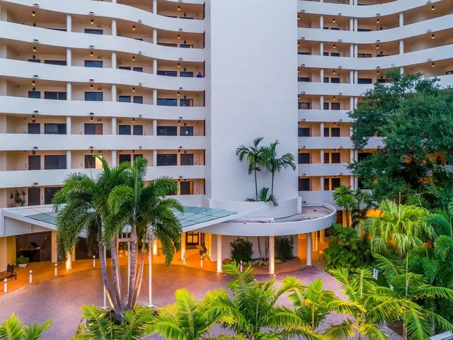 a view of building with river in front of it