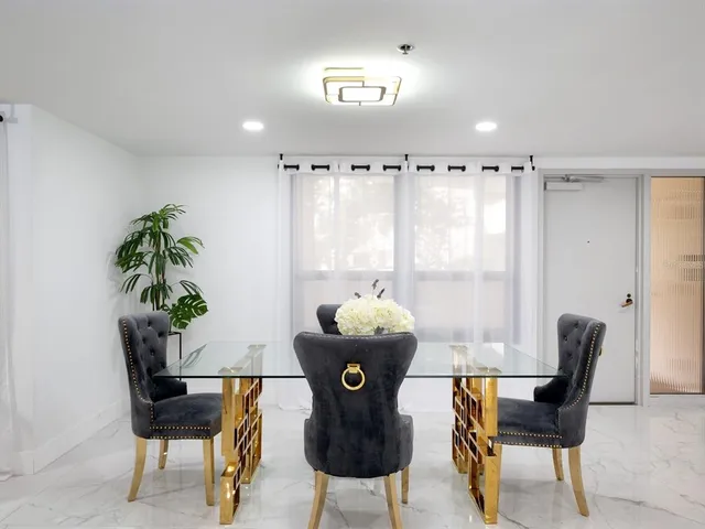 a kitchen with stainless steel appliances a stove microwave and refrigerator