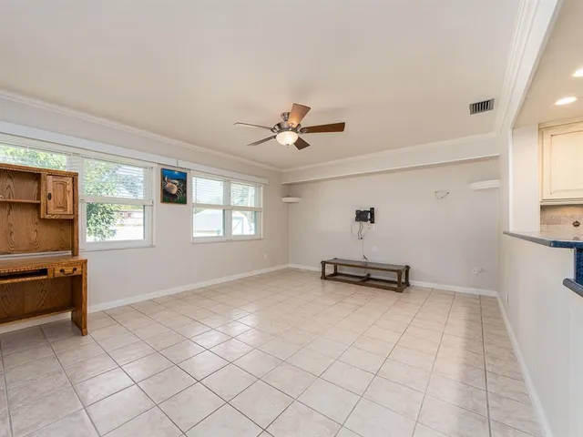 a view of a livingroom with furniture and windows
