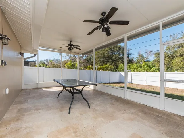 a view of a livingroom with furniture and a window