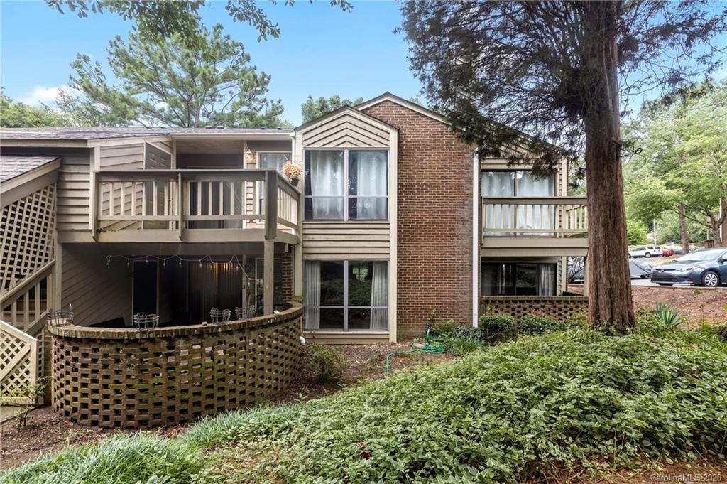 1606 Sharon Road West, Unit 33 Charlotte, NC 28210 - Photo 1 of 19 front view of a house with a door