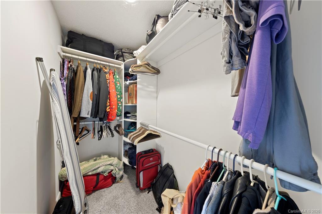 1606 Sharon Road West, Unit 33 Charlotte, NC 28210 - Photo 14 of 19 a view of walk in closet with clothes
