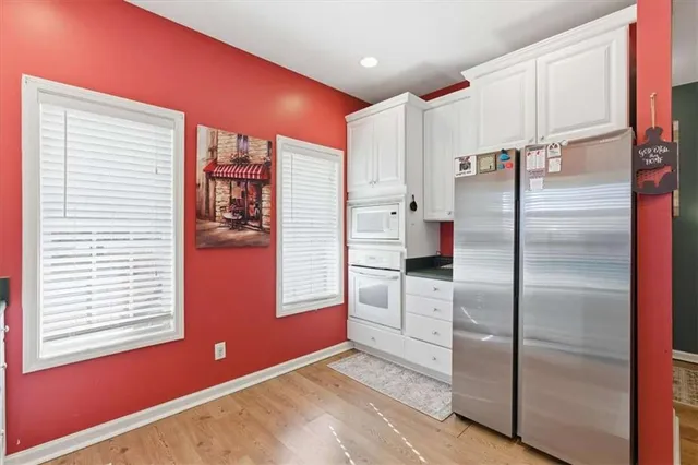 a kitchen with sink and cabinets