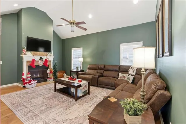 a living room with furniture and a flat screen tv