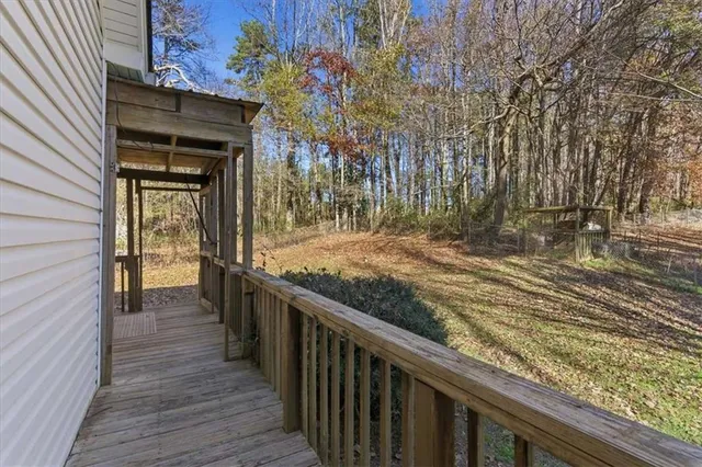 a view of a balcony with wooden floor