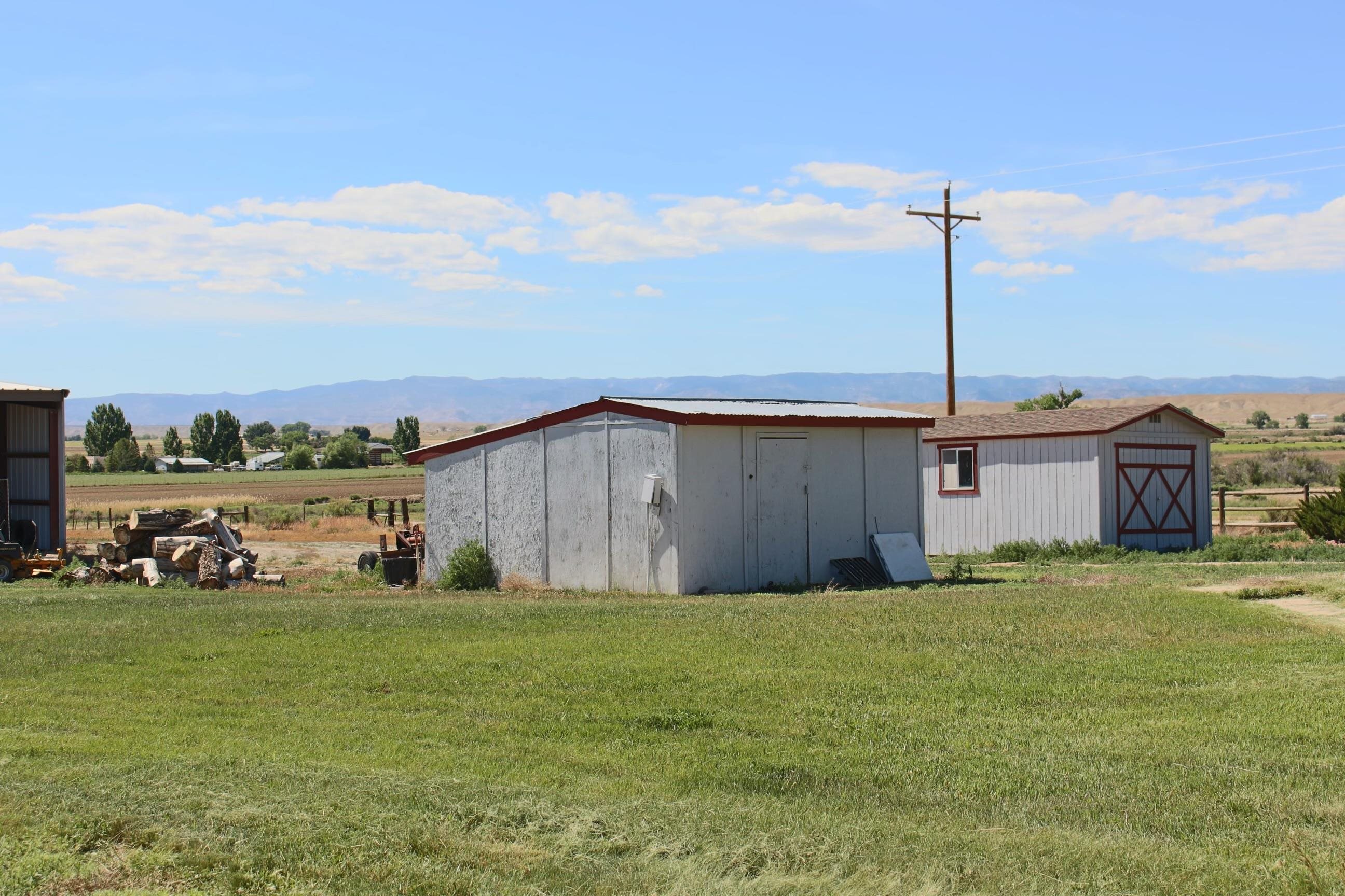 899 R Road Mack, CO 81525 - Photo 14 of 20 a view of a house with a yard