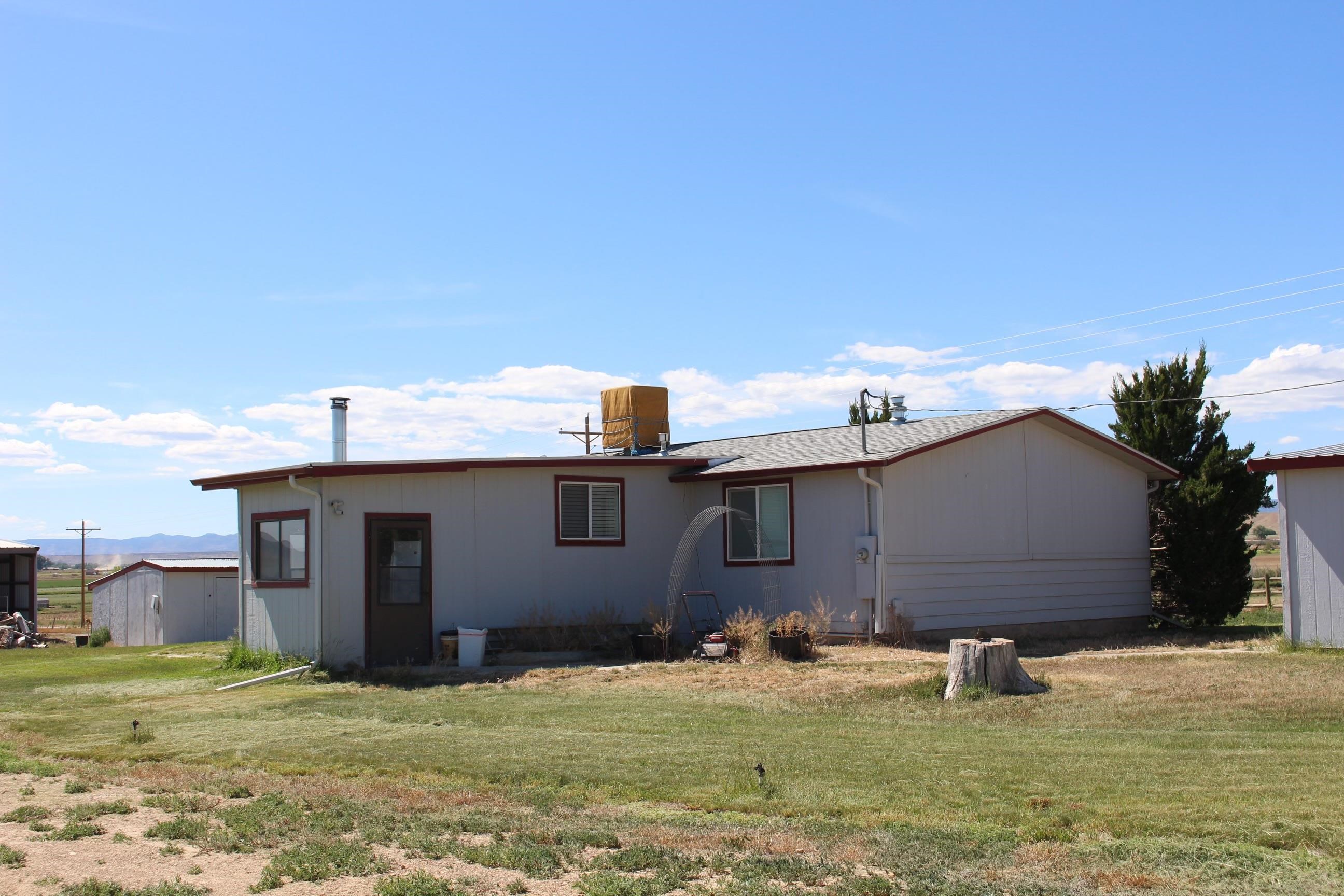 899 R Road Mack, CO 81525 - Photo 15 of 20 a house with yard in front of it