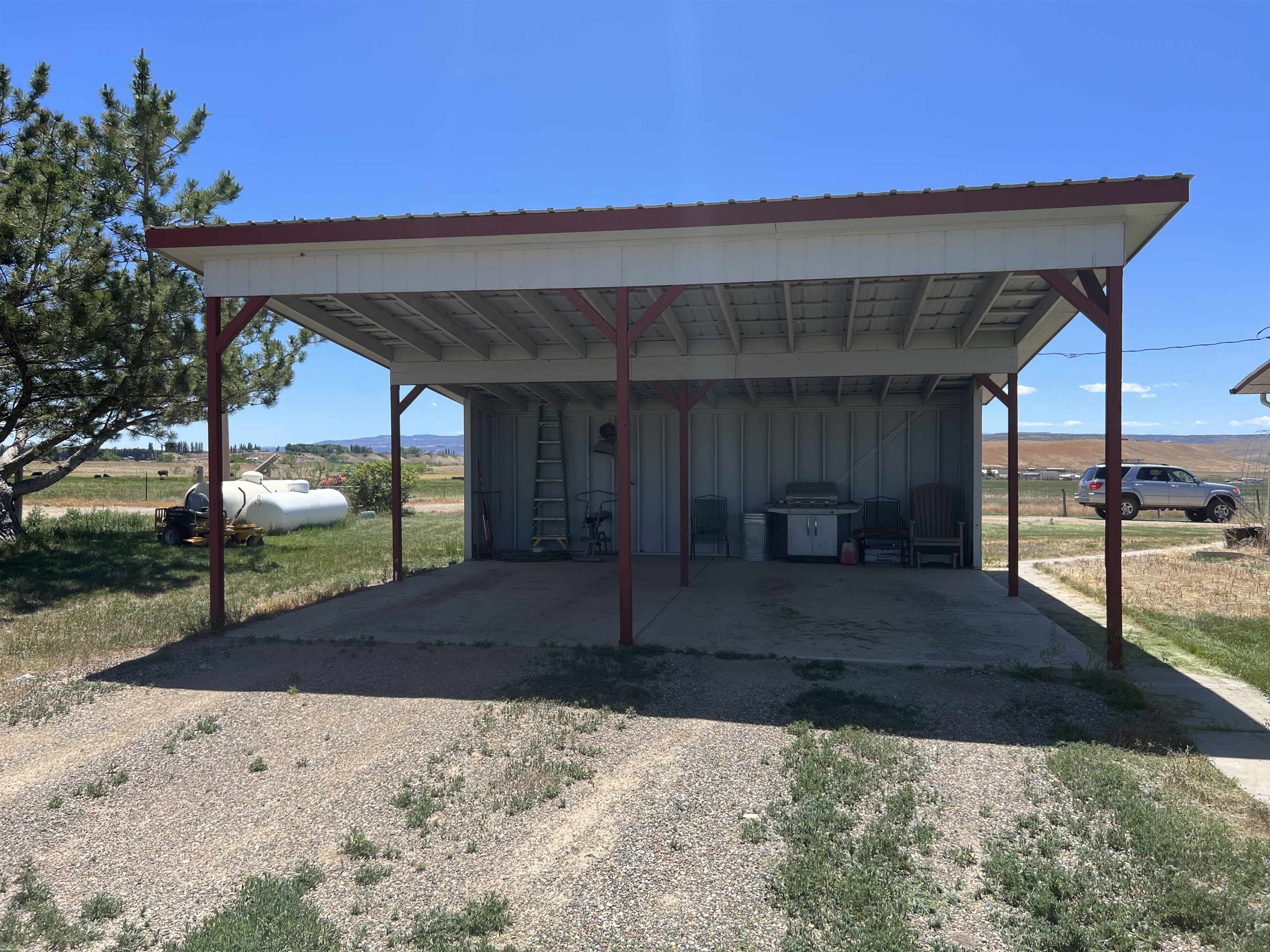 899 R Road Mack, CO 81525 - Photo 20 of 20 a view of a couches under an umbrella