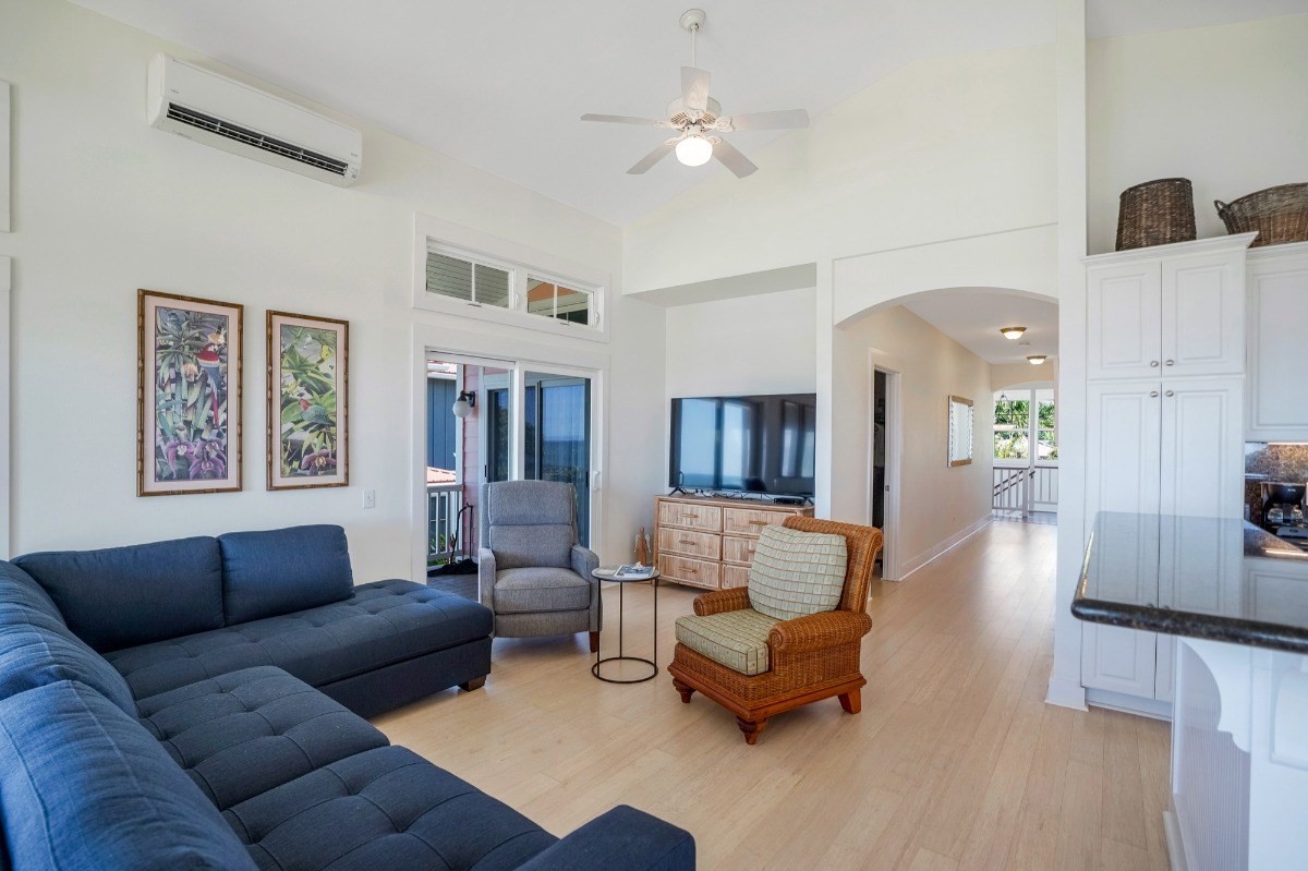 8264 Elepaio Road, Unit B Kekaha, HI 96752 - Photo 14 of 27 a living room with furniture and wooden floor