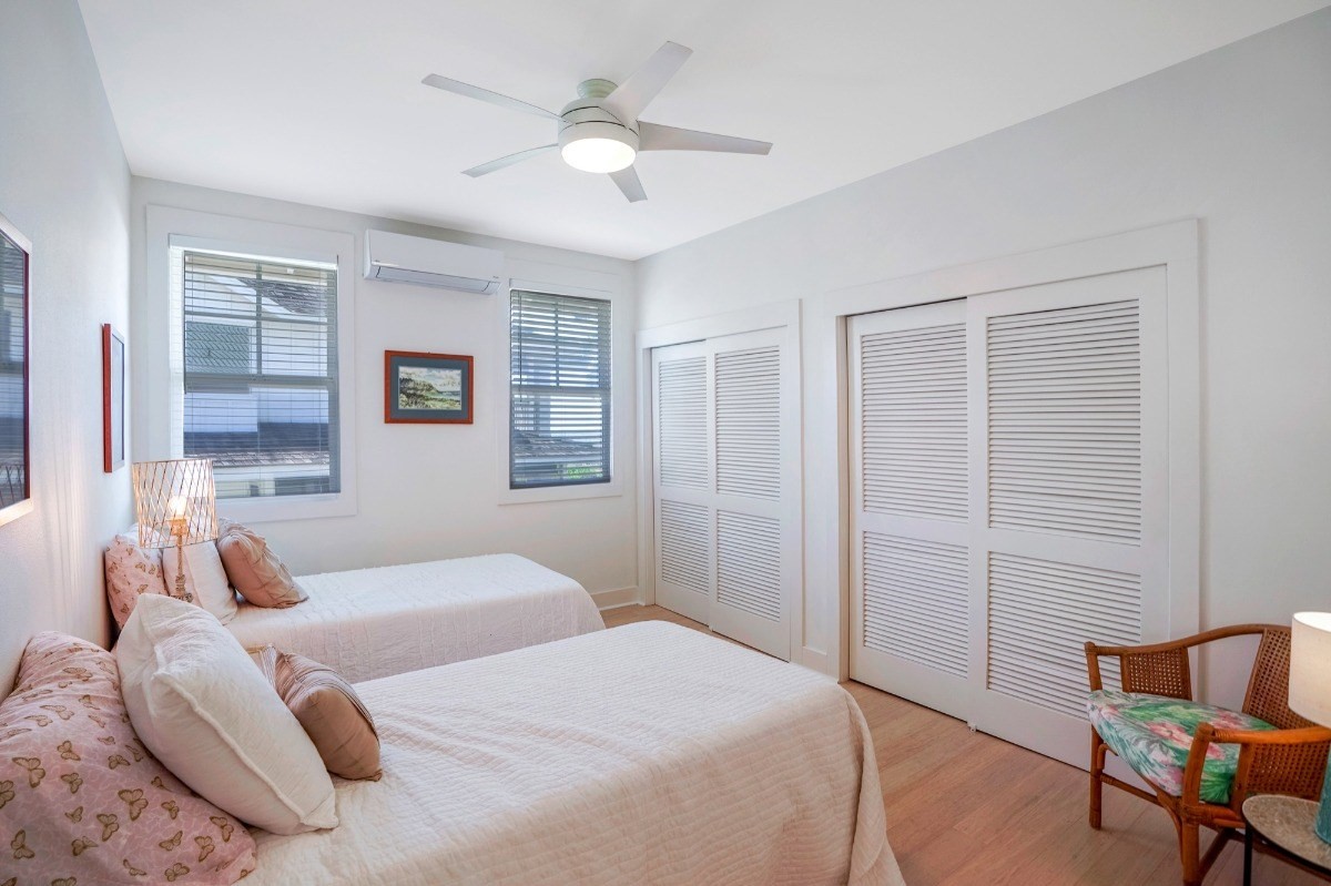8264 Elepaio Road, Unit B Kekaha, HI 96752 - Photo 22 of 27 a bedroom with a large bed and a window