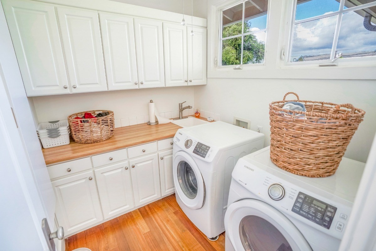 8264 Elepaio Road, Unit B Kekaha, HI 96752 - Photo 25 of 27 a utility room with dryer and washer