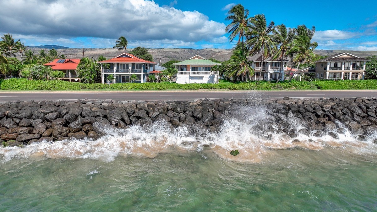 8264 Elepaio Road, Unit B Kekaha, HI 96752 - Photo 9 of 27 a front view of a house with a yard and green space