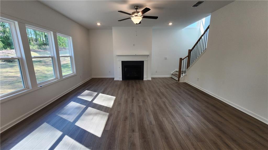 204 Silverleaf Trail Bethlehem, GA 30620 - Photo 13 of 41 wooden floor in an empty room with a window