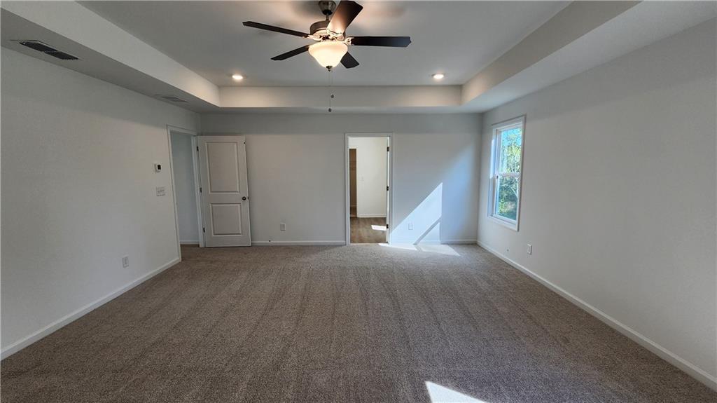 204 Silverleaf Trail Bethlehem, GA 30620 - Photo 17 of 41 a view of a livingroom with a ceiling fan and window