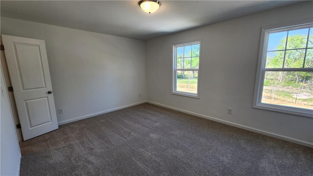 204 Silverleaf Trail Bethlehem, GA 30620 - Photo 20 of 41 an empty room with windows and closet