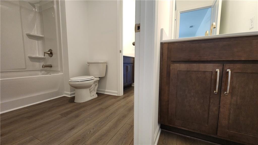 204 Silverleaf Trail Bethlehem, GA 30620 - Photo 22 of 41 a bathroom with a toilet a sink and bathtub