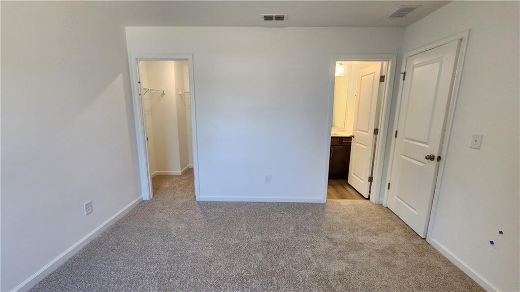204 Silverleaf Trail Bethlehem, GA 30620 - Photo 26 of 41 an empty room with windows and entrance