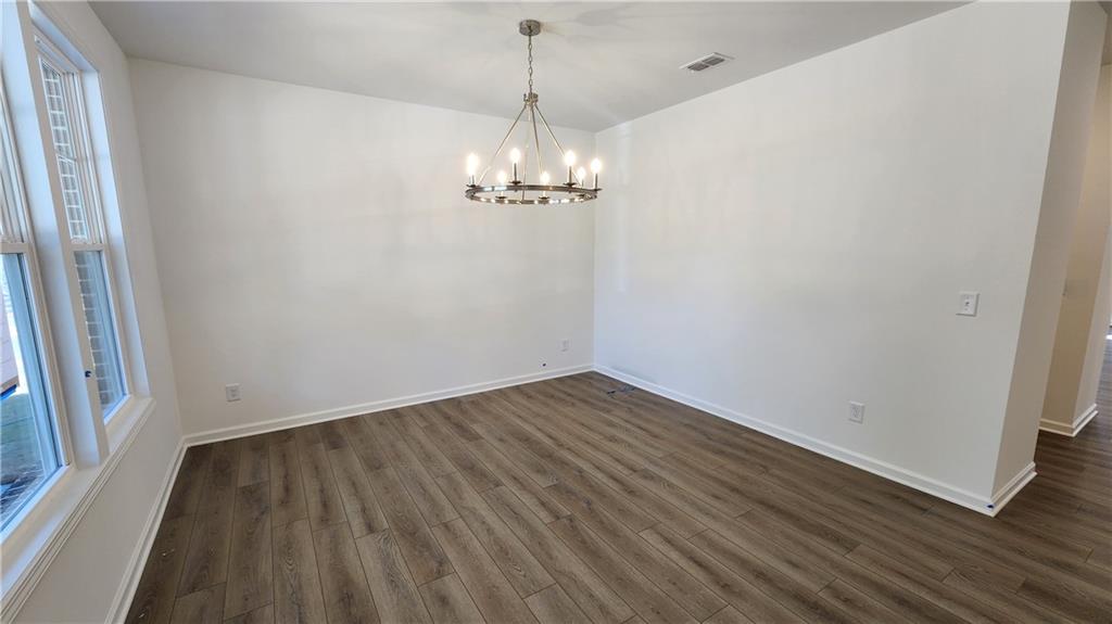 204 Silverleaf Trail Bethlehem, GA 30620 - Photo 5 of 41 a view of a room with wooden floor and large window