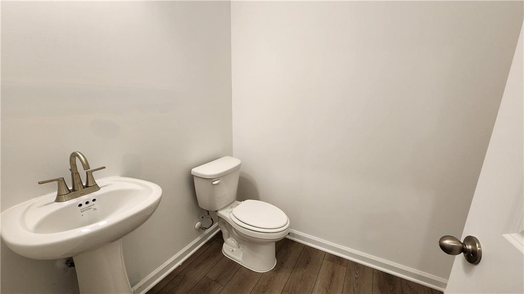204 Silverleaf Trail Bethlehem, GA 30620 - Photo 7 of 41 a bathroom with a sink a toilet and a mirror
