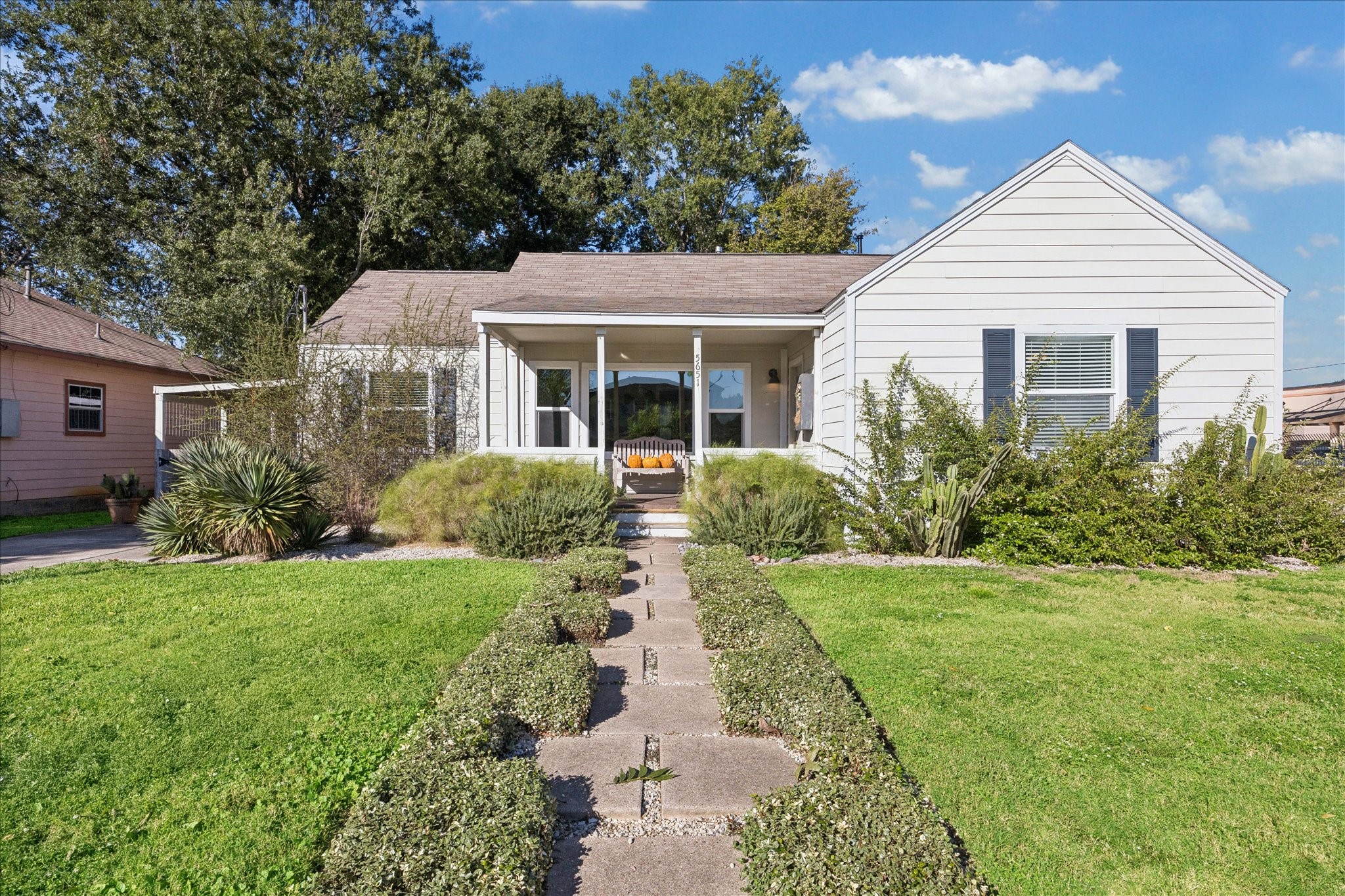 5651 Truett Street Houston, TX 77023 - Photo 1 of 19 a front view of a house with a yard