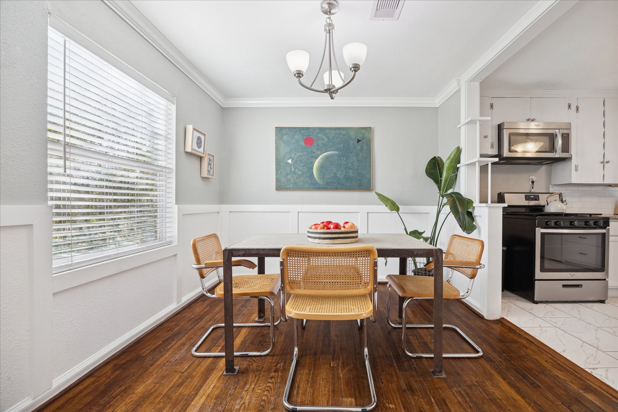 5651 Truett Street Houston, TX 77023 - Photo 11 of 19 a view of a dining room with furniture window and wooden floor