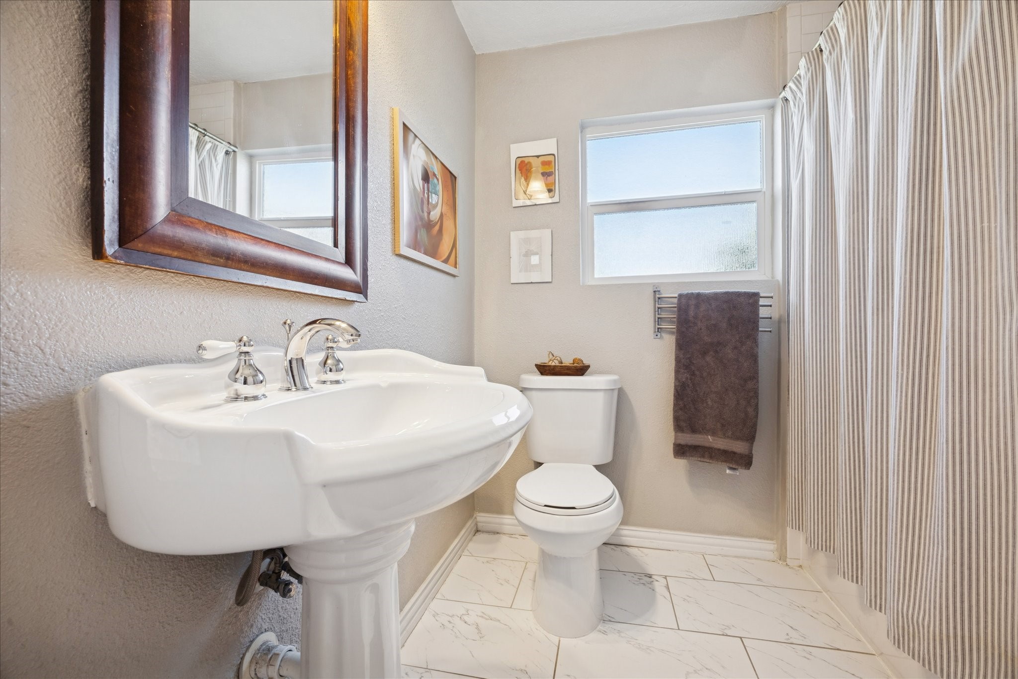 5651 Truett Street Houston, TX 77023 - Photo 15 of 19 a bathroom with a sink a toilet and a mirror