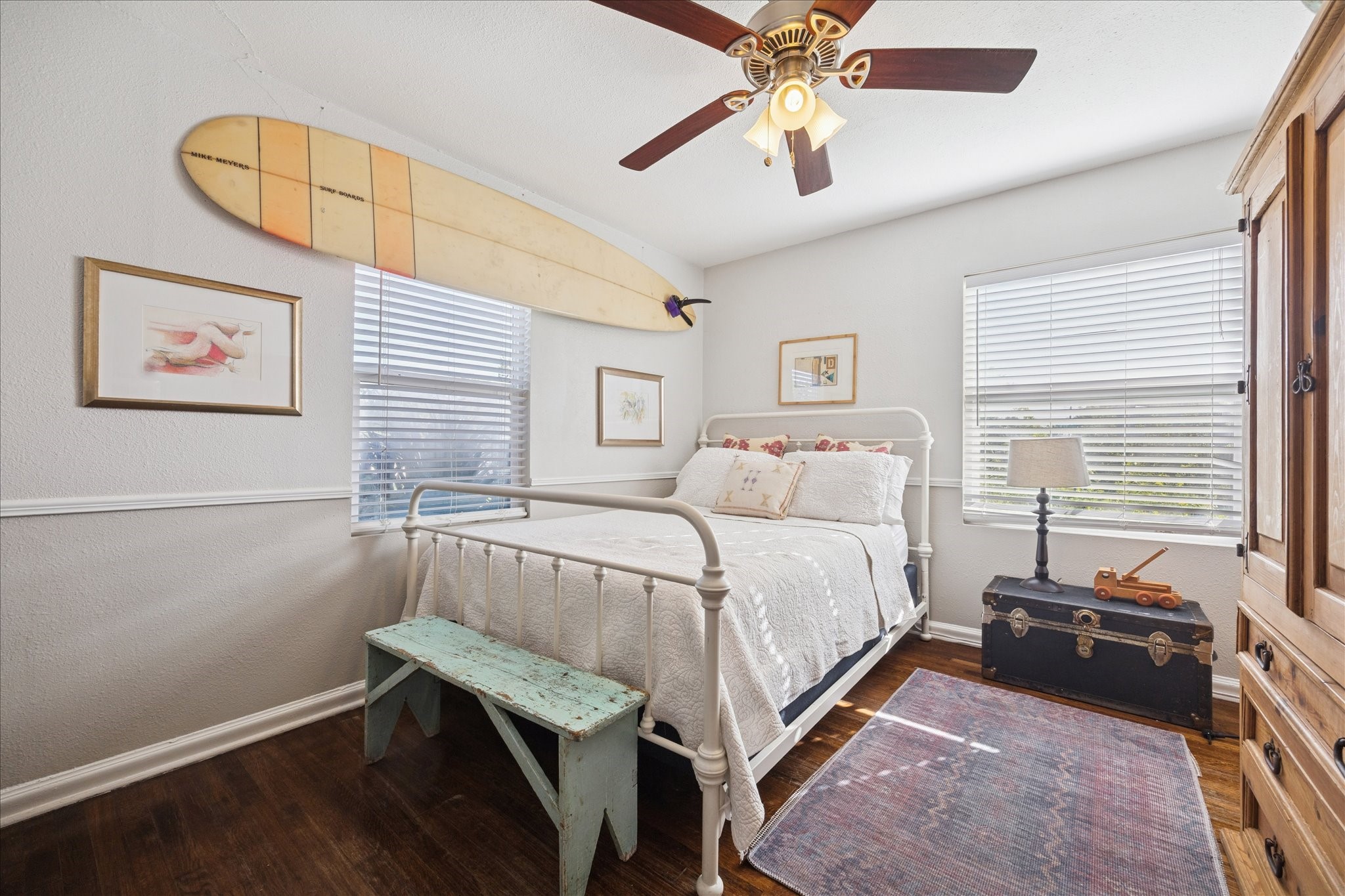 5651 Truett Street Houston, TX 77023 - Photo 16 of 19 a bedroom with a bed and a chandelier