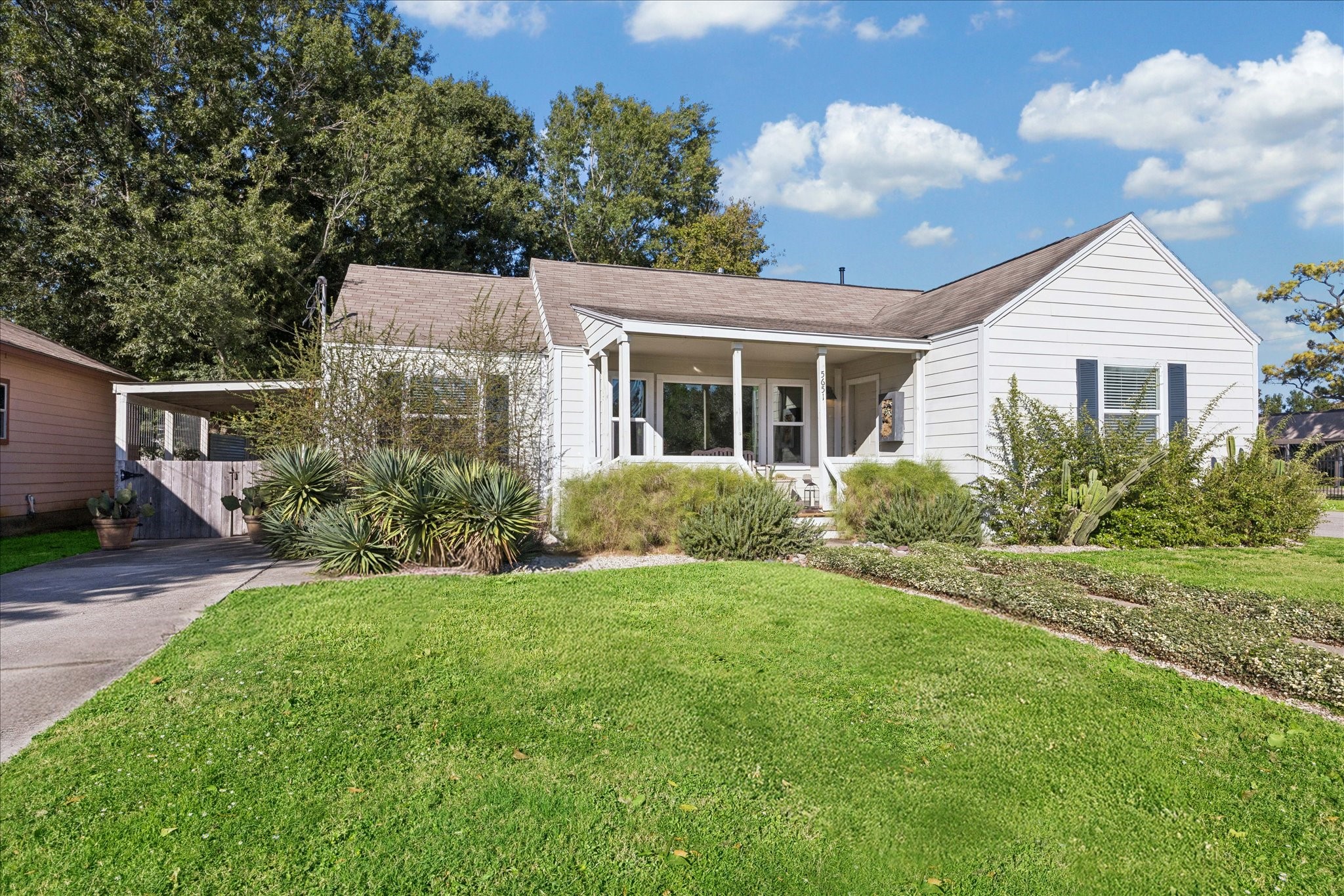 5651 Truett Street Houston, TX 77023 - Photo 2 of 19 front view of a house with a yard