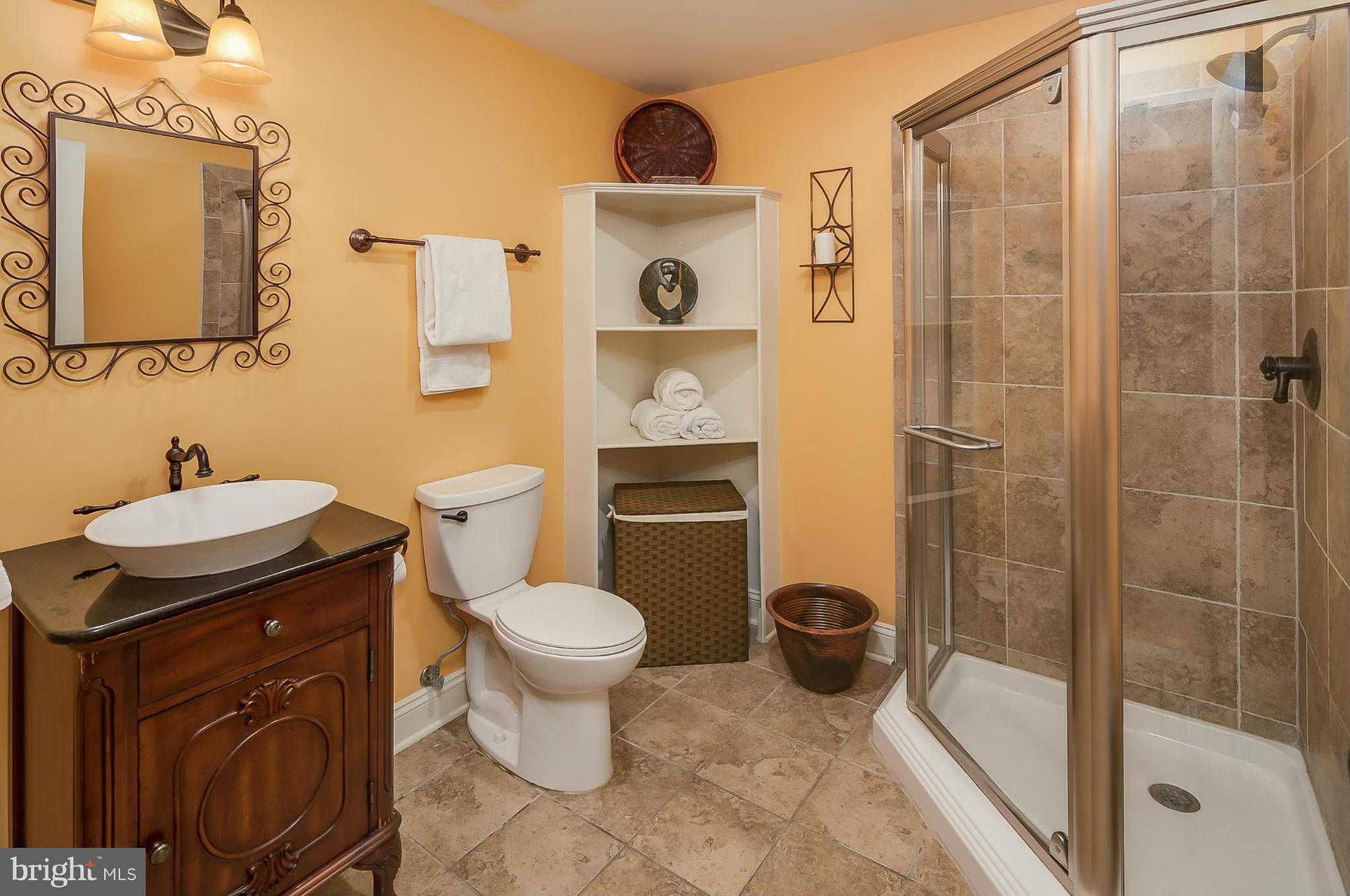 5949 Sandy Ridge Elkridge, MD 21075 - Photo 23 of 30 a bathroom with a sink a toilet and a shower