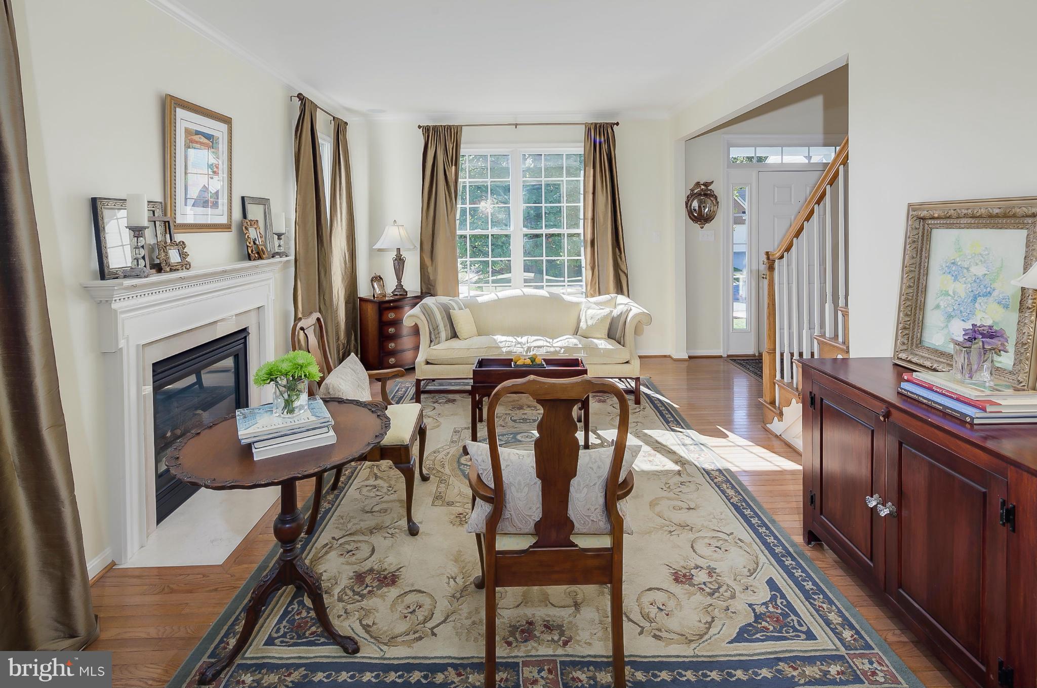 5949 Sandy Ridge Elkridge, MD 21075 - Photo 4 of 30 a living room with furniture and a fireplace
