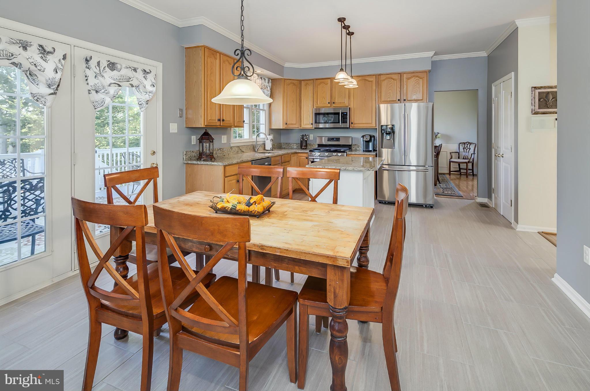5949 Sandy Ridge Elkridge, MD 21075 - Photo 9 of 30 a view of a dining room with furniture window and outside view
