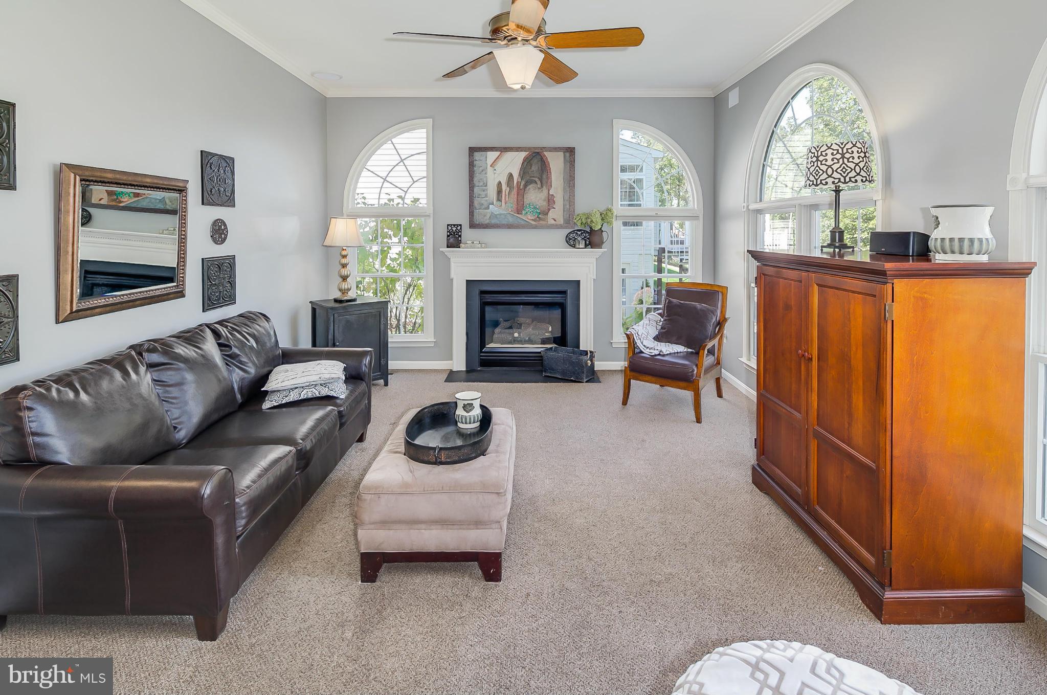 5949 Sandy Ridge Elkridge, MD 21075 - Photo 10 of 30 a living room with furniture and a fireplace
