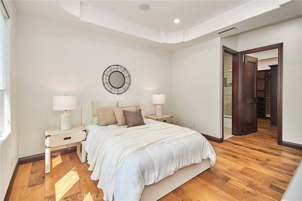 1051 Arroyo Drive Fullerton, CA 92833 - Photo 18 of 73 a bedroom with a bed and wooden floor