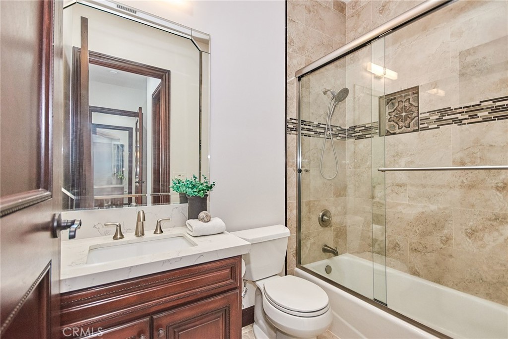 1051 Arroyo Drive Fullerton, CA 92833 - Photo 20 of 73 a bathroom with a sink a toilet and shower