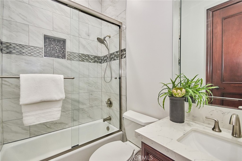 1051 Arroyo Drive Fullerton, CA 92833 - Photo 21 of 73 a bathroom with a sink a toilet and shower