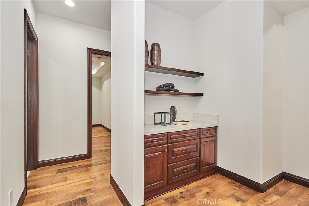 1051 Arroyo Drive Fullerton, CA 92833 - Photo 22 of 73 a kitchen with a refrigerator and cabinets