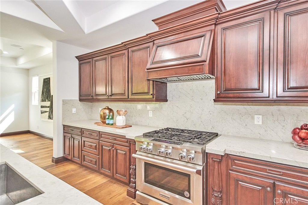 1051 Arroyo Drive Fullerton, CA 92833 - Photo 34 of 73 a kitchen with stainless steel appliances granite countertop a stove and a microwave