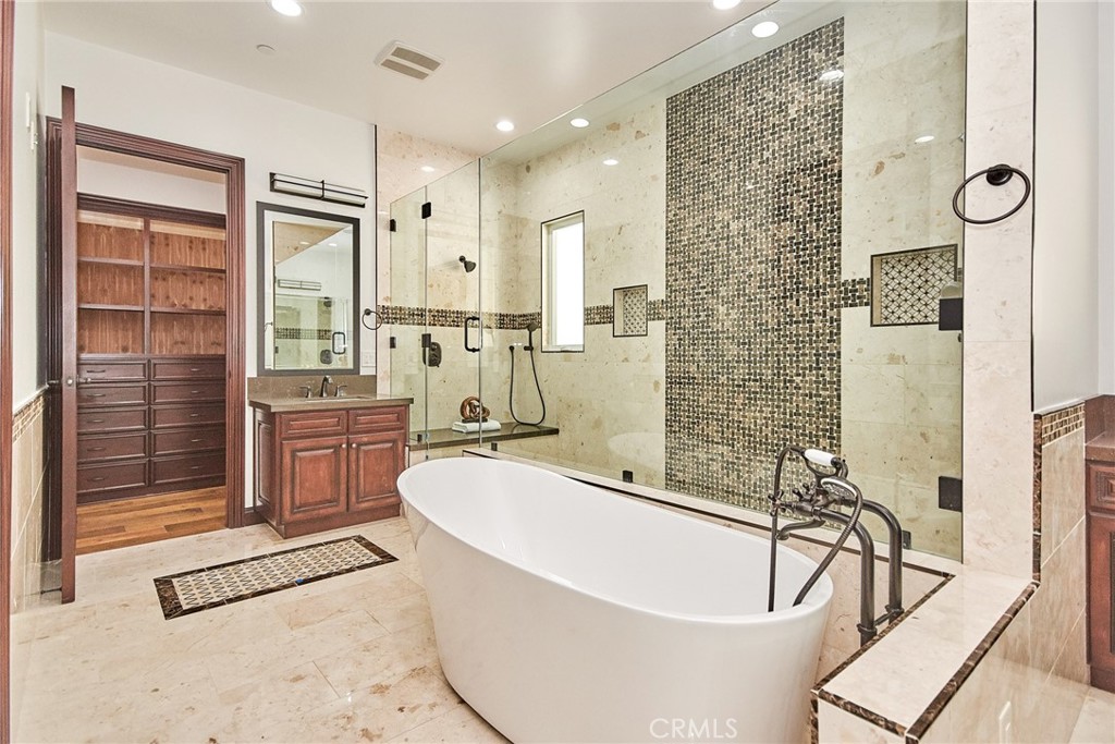 1051 Arroyo Drive Fullerton, CA 92833 - Photo 47 of 73 a bathroom with a tub a sink and a shower