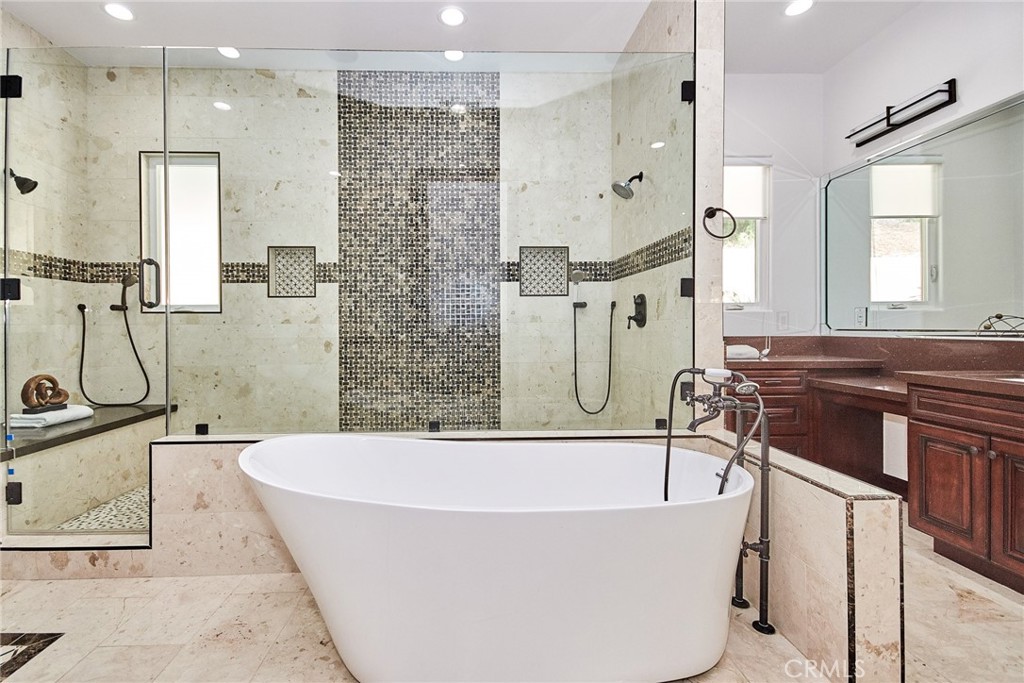 1051 Arroyo Drive Fullerton, CA 92833 - Photo 49 of 73 a bathroom with a bathtub and a sink