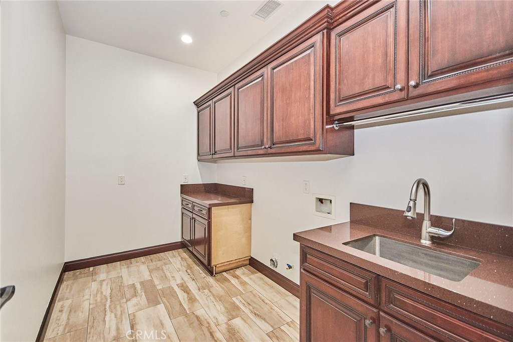 1051 Arroyo Drive Fullerton, CA 92833 - Photo 53 of 73 a kitchen with a sink cabinets and appliances