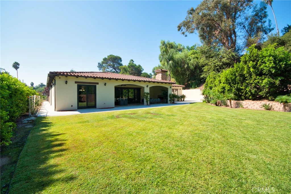 1051 Arroyo Drive Fullerton, CA 92833 - Photo 62 of 73 a front view of a house with a garden and yard