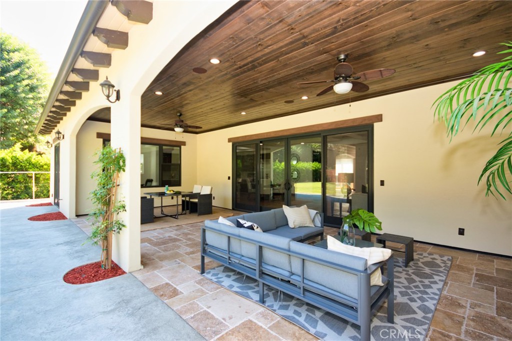 1051 Arroyo Drive Fullerton, CA 92833 - Photo 63 of 73 a living room with patio furniture and floor to ceiling window