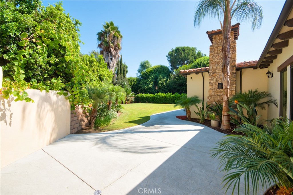 1051 Arroyo Drive Fullerton, CA 92833 - Photo 65 of 73 a view of a yard in front of a house with a fountain